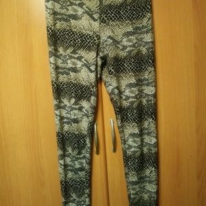 Leopard print thighs. Polyester and lycra material